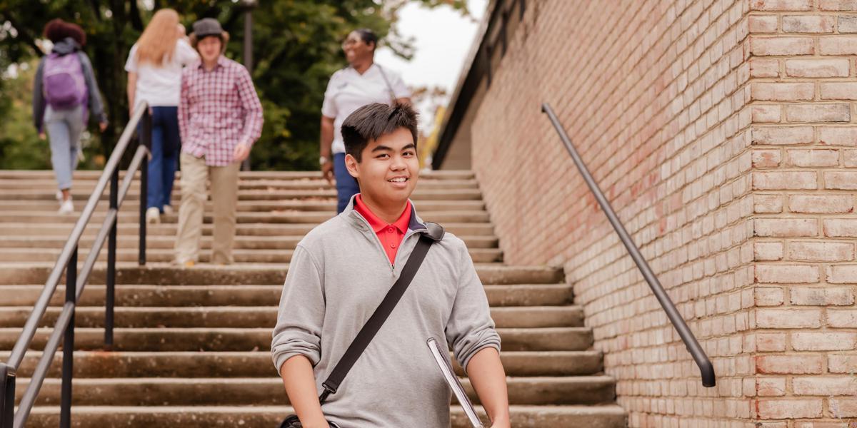 AACC student walking outside at the Arnold campus.